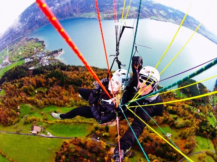 A couple paragliding on their honeymoon in Interlaken