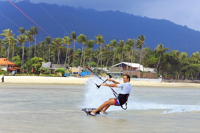 An adventurer tries kitesurfing on Koh Samui island