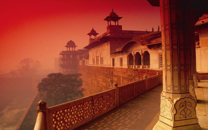 The rich red sandstone walls of the Agra Fort