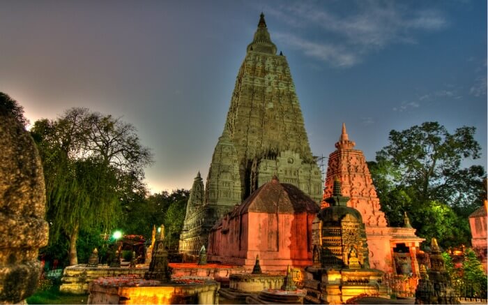 Smaller stupas and Buddha statues in the courtyard surrounding the Mahabodhi temple