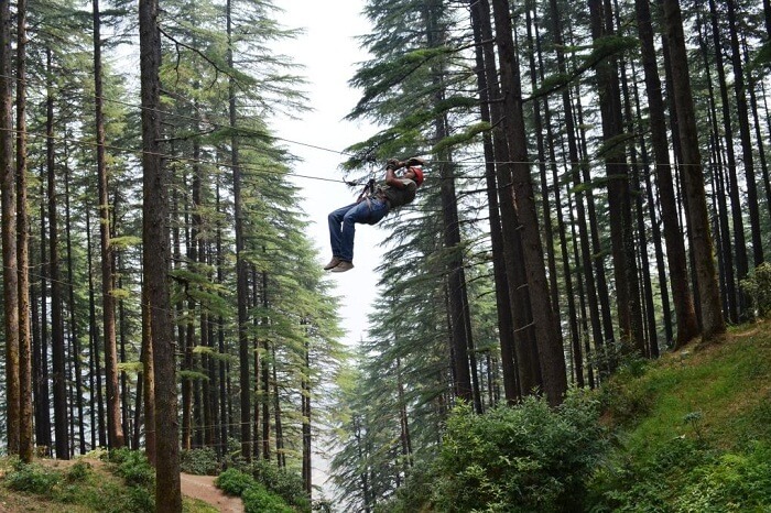 A person tries Valley Crossing in Kanatal