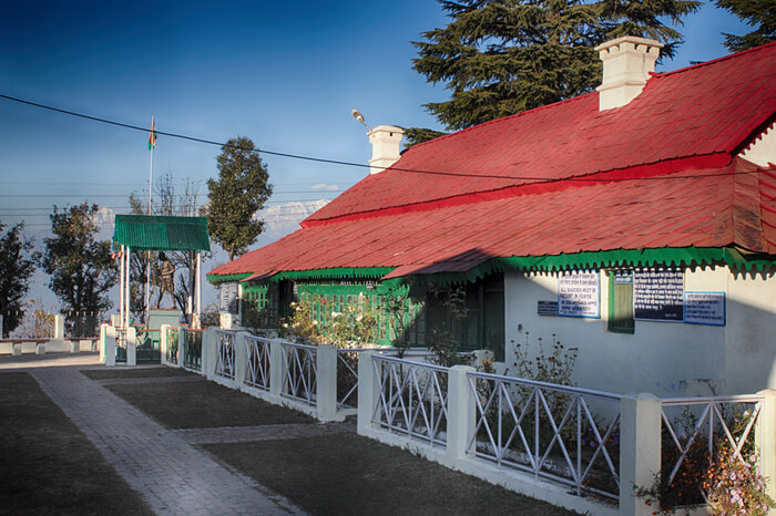 Backside of Anashakti Ashram with red tin roof