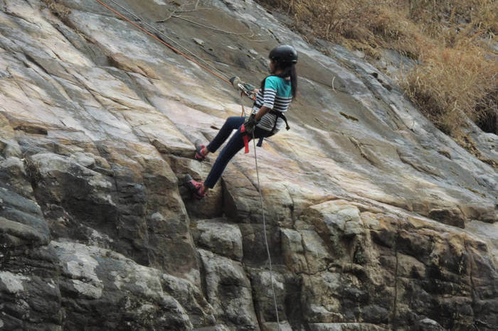 A girl rock climbing