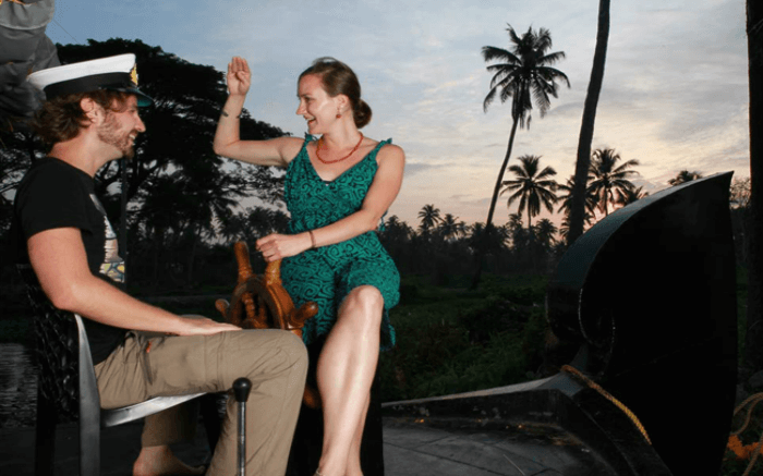 Couple sharing light moments together at Honeymoon Houseboat in Alleppey 