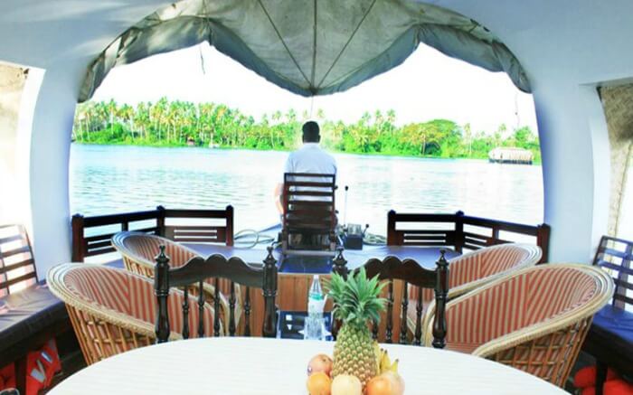 Well laid-out dining table with front deck of Welcome Cruise in Alleppey 