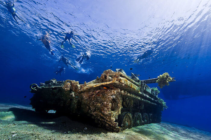 People diving in Aqaba near Tank Wreck