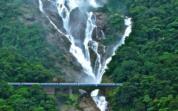 AnIndian Railway train crossing the Dudhsagar Falls near Goa