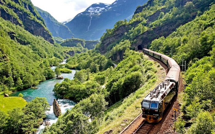 Atrain of Bergen Railway running across the mountains in Norway