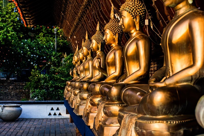 Payyour respects at the stunning Gangaramaya Temple in Sri Lanka