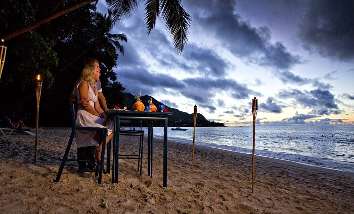 A couple having a quiet dinner in Seychelles
