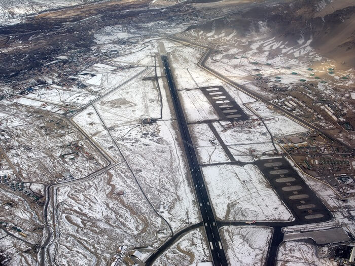 An aerial view of the snow covered Leh airport