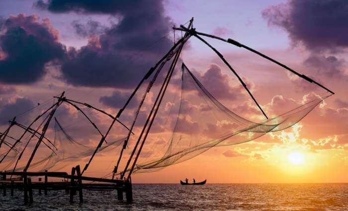 The morning rituals of throwing fishing nets in the sea at Veeranpuzha Beach