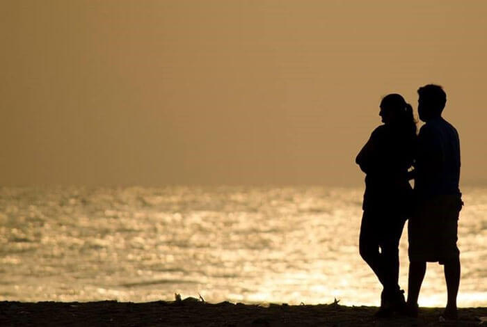 A couple chilling at the Marina Beach in Chennai