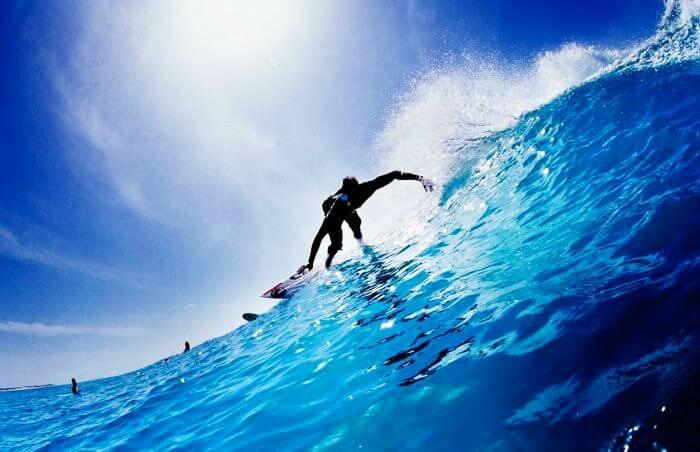 A professional sea surfing at Arugam Bay on a Sri Lankan beach
