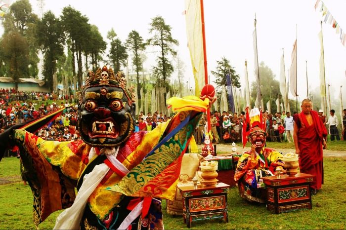 A lama performing the masked dance in Sikkim