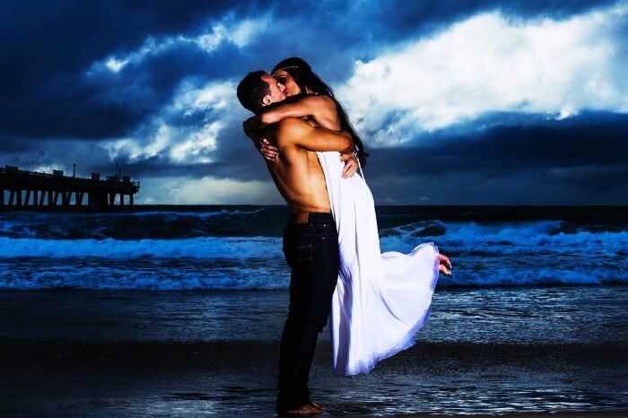 A couple kissing on the beach