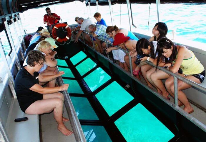 Riding in Glass-bottom boats is one of the best water activities in Maldives to view the exquisite corals