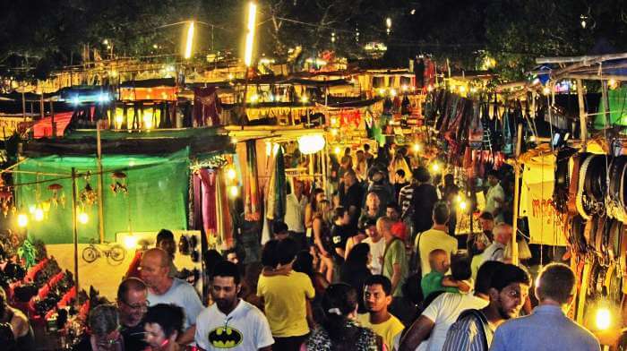 Go for shopping at Saturday night market at Arpora