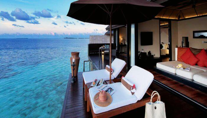 View of the vast ocean and a luxury over water villa at Lily Beach Maldives Resort