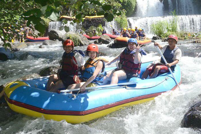 Tourists preparing for an exciting river rafting experience in the waters of Bali