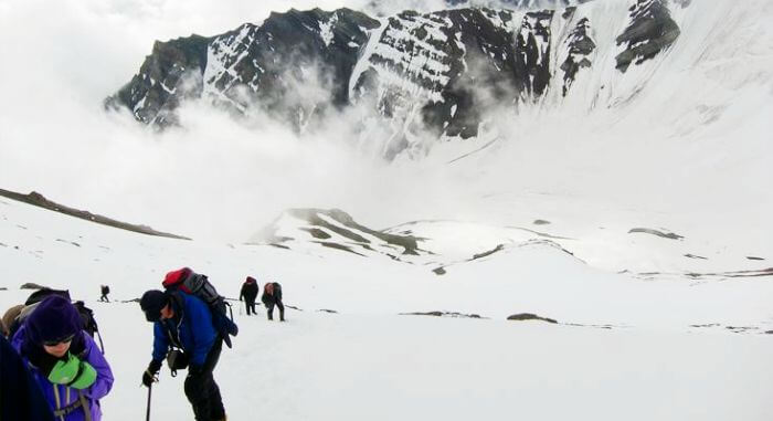 Trekkers climb the Stok summit as a part of lamayuru-stok trek