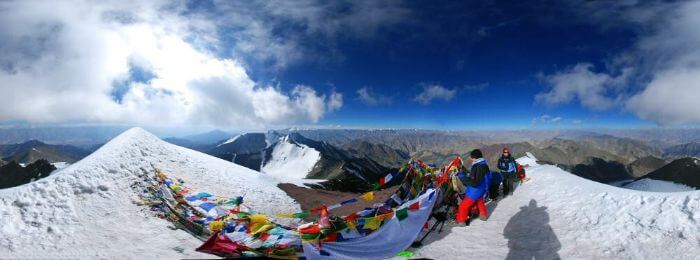 Trekkers rest on the top of Stok Summit