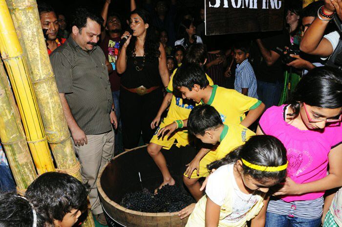 Kids enjoying wine stomping at the most unique festival in Goa & in India - The Grape Escapade