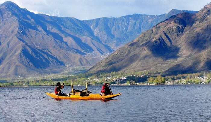 A boat being rowed at Dal Lake in Kashmir
