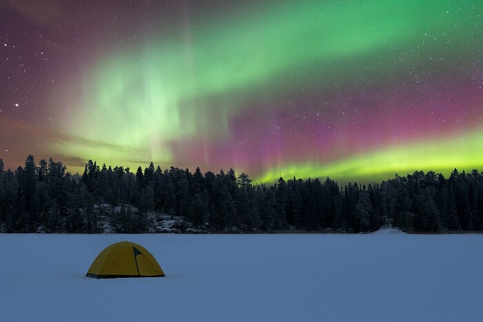 A camping tent on a frozen lake