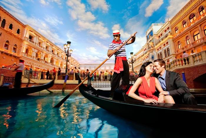 A couple on a boat in Venice