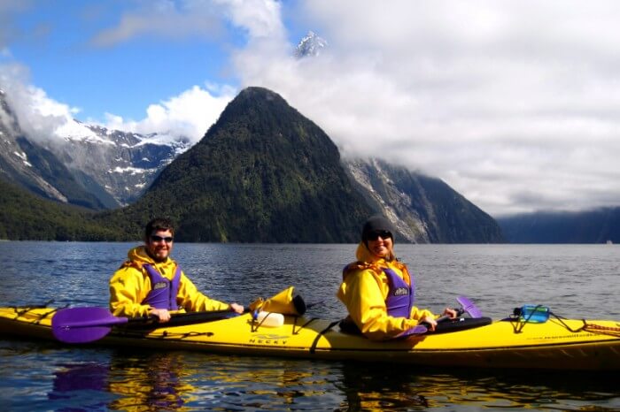 Honeymooners enjoy Kayaking in the beautiful backgrounds of Milford Sound