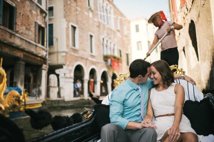 A couple cuddling up on a Gondola Ride in Venice