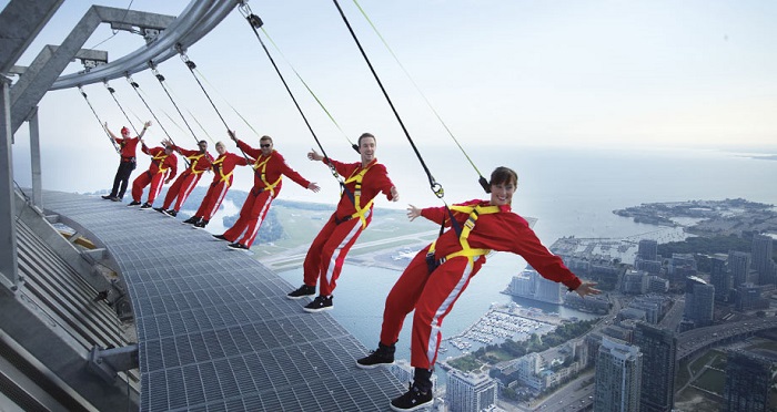 People engaging in Edge Walking on the roof of the CN Tower