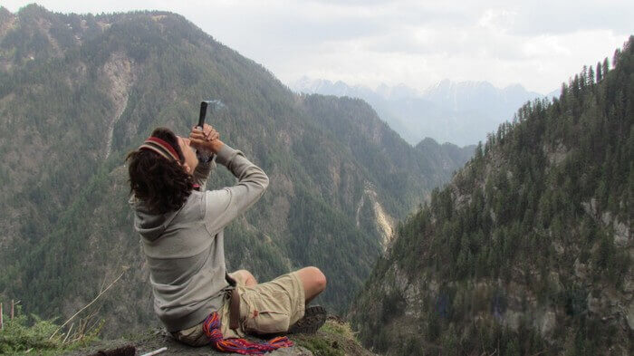 A young tourist smoking hash in Kasol