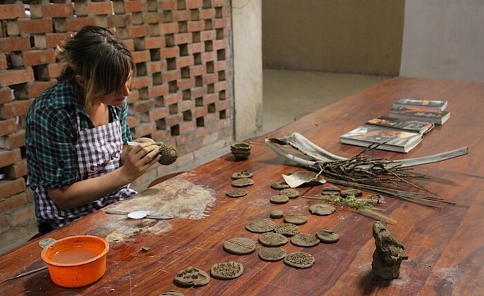 An enthusiast trying her hand at pottery at Urakam in Kerala