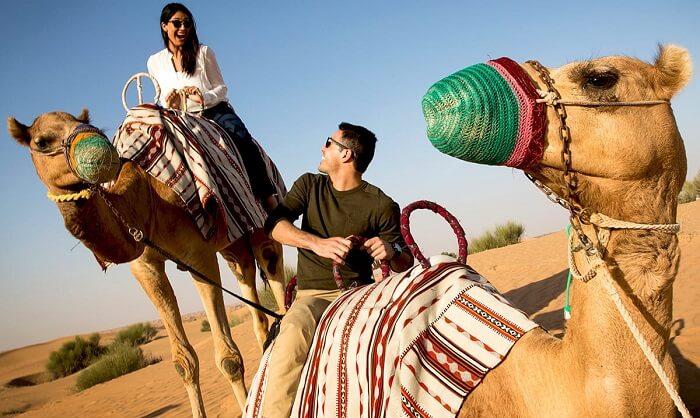 A couple indulging in camel safari during Dubai Shopping Festival 2016
