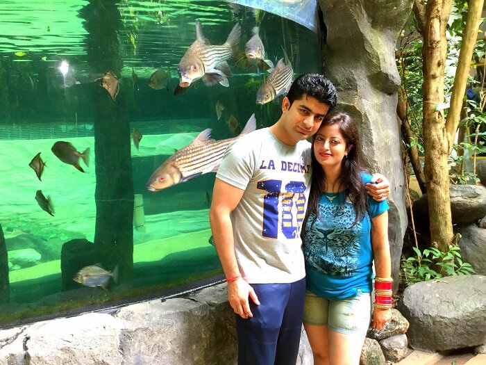 In front of an aquarium at the Under Water World Langkawi