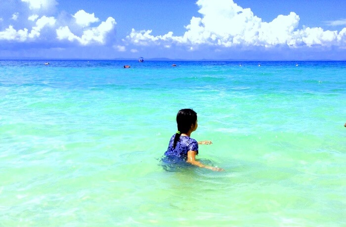 splashing around the tranquil waters of Red Skin Island