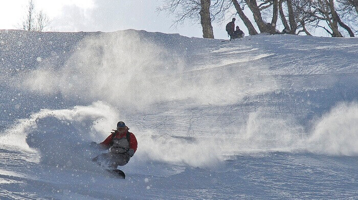 Ski-Resort-A person tries snowboarding at Auli Ski Resort