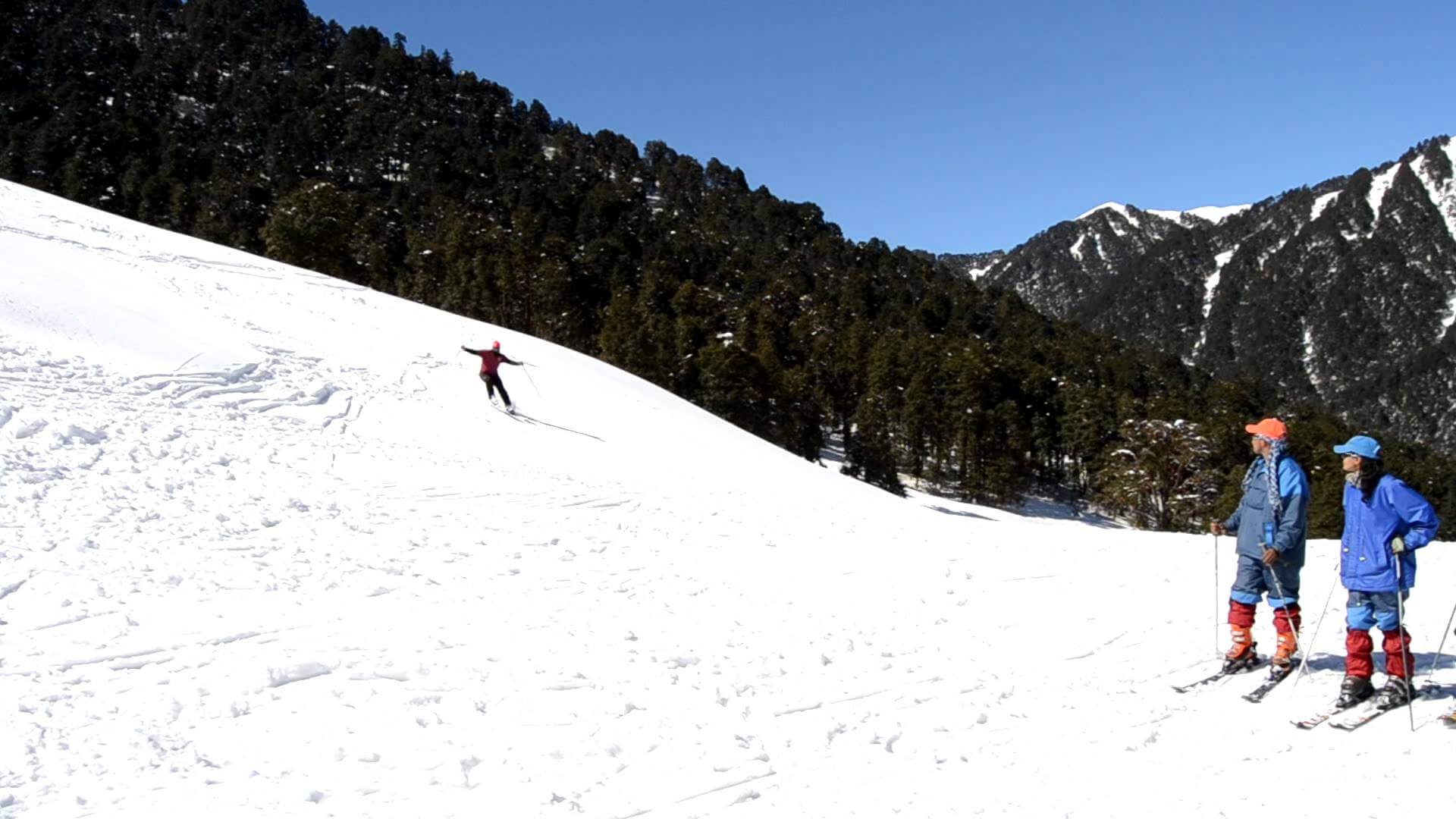 Skiers can be seen enjoying skiing at Dayara Bugyal