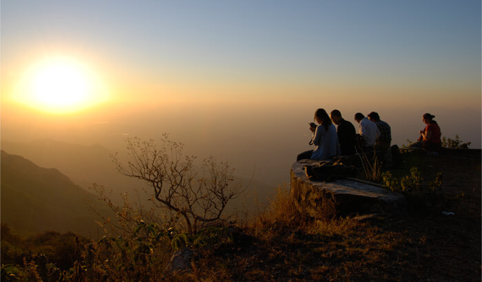 Friends enjoying sunset at the Sunset Point at Mount Abu in Rajasthan