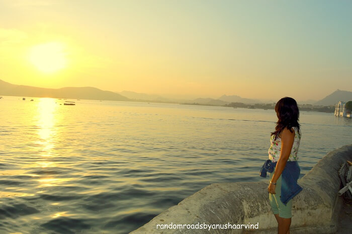 Anusha witnessing the sun rise in Lake Pichola Udaipur