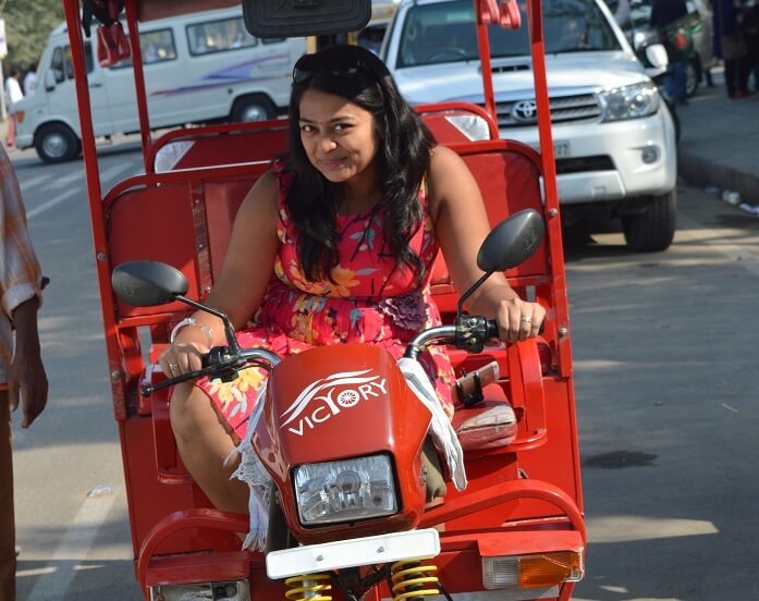 Anusha driving an Erickshaw