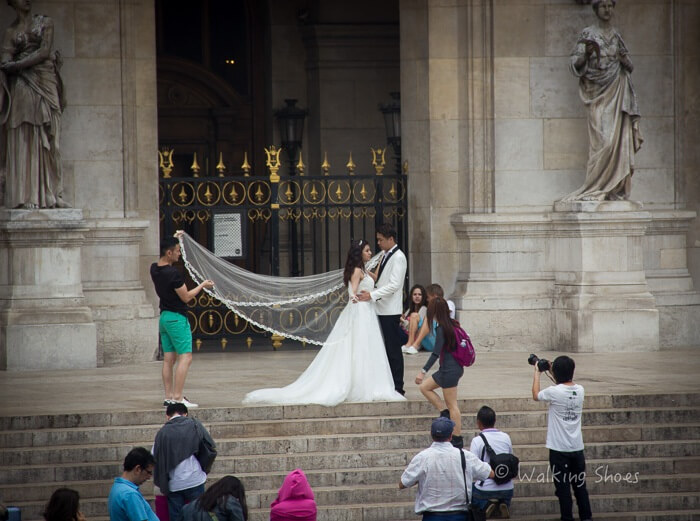 A married couple outside a church in Paris