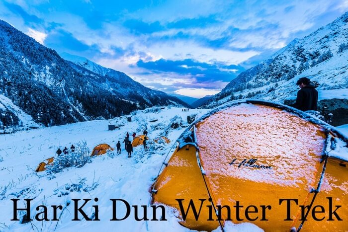 Trekkers rest in tents on the snow carpet on a Har Ki Dun winter trek