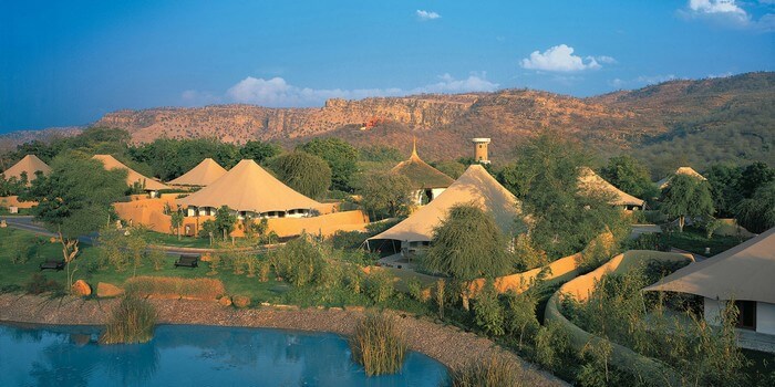 Vanya Vilas rests on the bank of a sparkling river