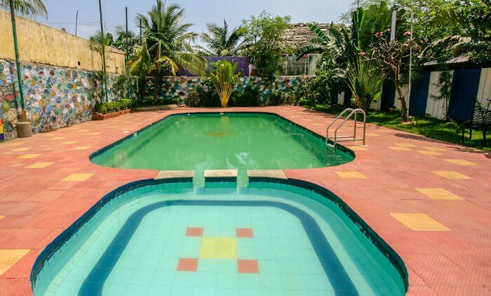 the pool view at beach park and club resort in chennai