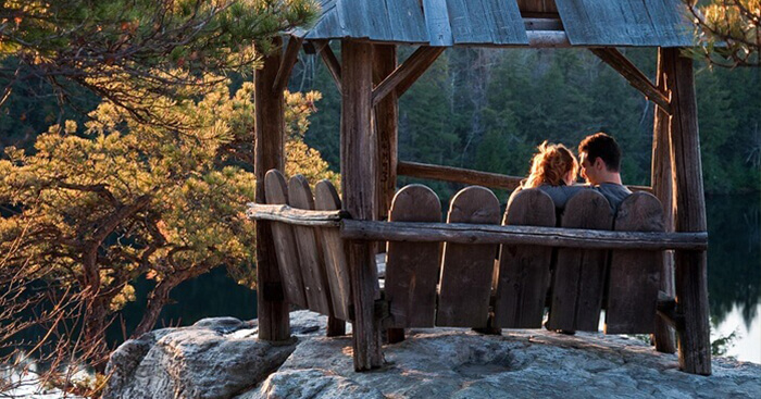 couple sitting near the serene beauty of Karnataka
