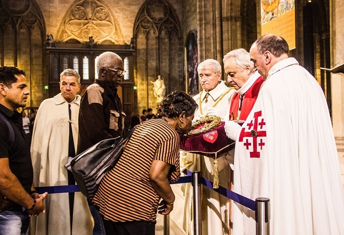 People praying inside a church in Paris