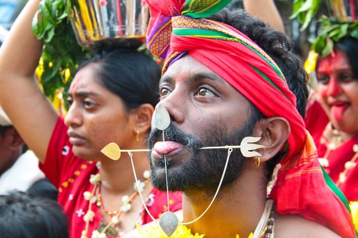A Kavadi with pierced tongue and cheeks at Batu Caves Temples